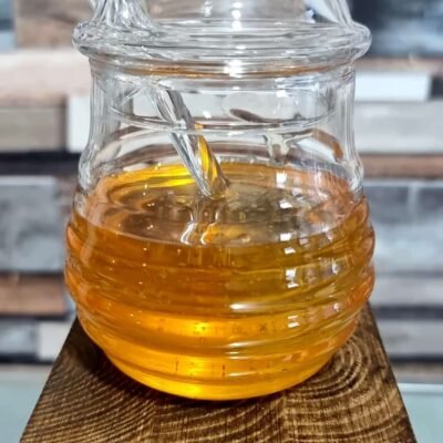 Glass honey jar with honey